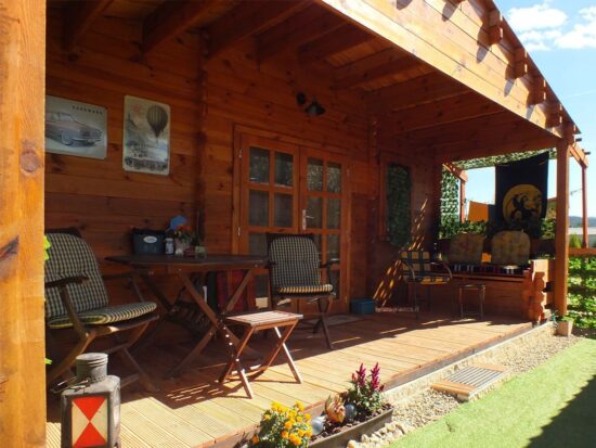Foto client 2 Casă din lemn izolată, 75mp, 3 camere, baie, veranda, perete dublu de 44mm + Izolație + 44mm, 13x6m, DONNA