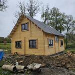 Foto client Casă din lemn izolată cu mansardă, terasă acoperită, living, 2 dormitoare și 3 băi, Doris