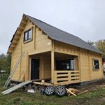 Foto client Casă din lemn izolată cu mansardă, terasă acoperită, living, 2 dormitoare și 3 băi, Doris