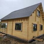 Foto client Casă din lemn izolată cu mansardă, terasă acoperită, living, 2 dormitoare și 3 băi, Doris