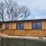 Tulcea-montaj casă din lemn modulară 52mp MIRELA living 2 dormitoare baie terasa acoperita